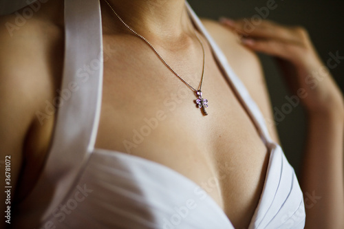 Beautiful adornment on neck of young bride photo