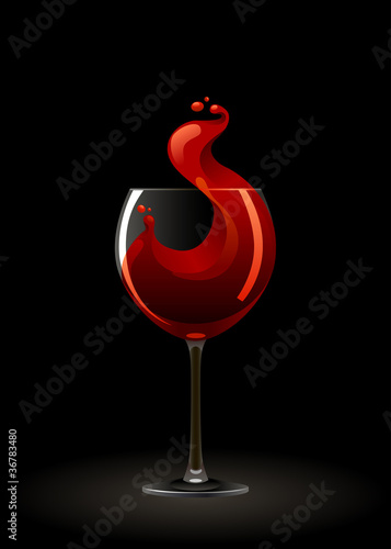 Glass of red wine on a black background