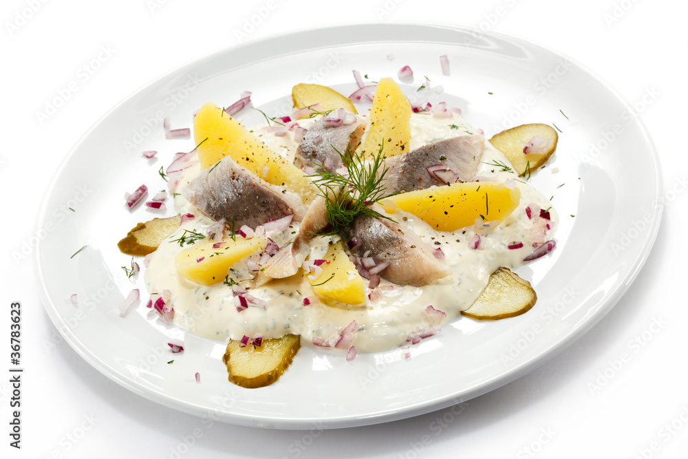 Marinated herring fillets with cream and vegetables Marinated herring fillets with cream and vegetables