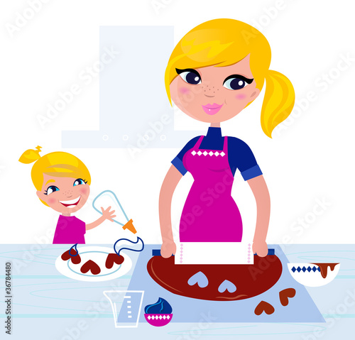 Cute Girl helping her Mother with christmas baking..