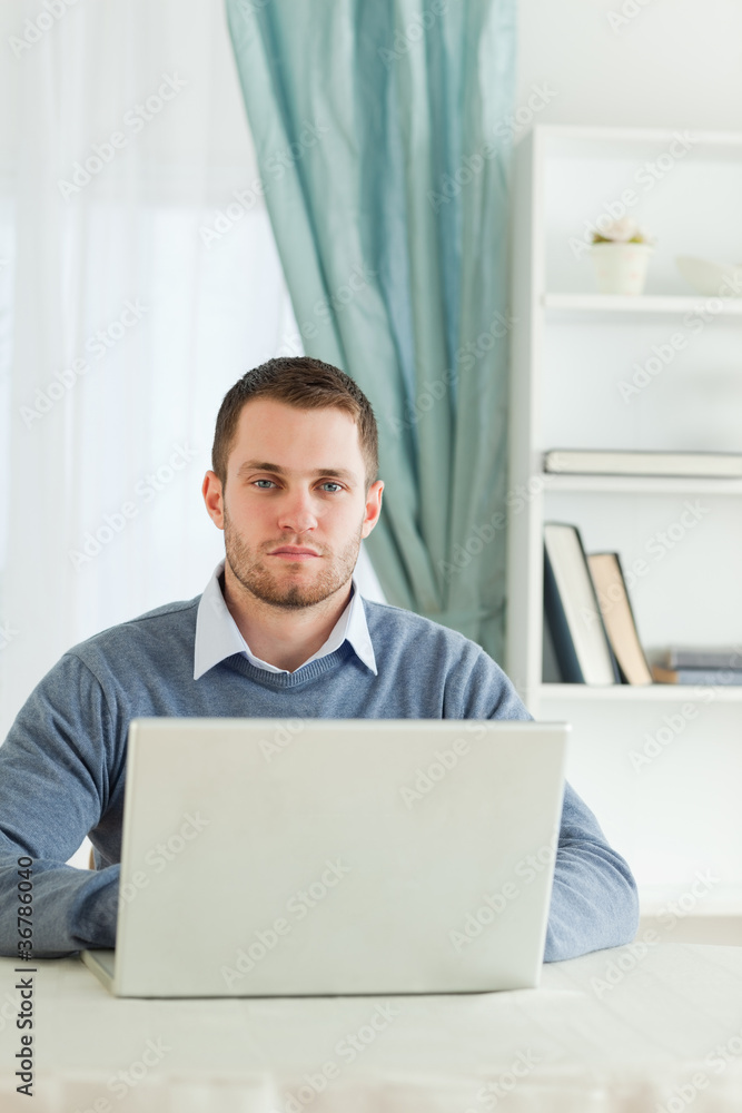 Businessman sitting in his homeoffice Businessman sitting in his homeoffice