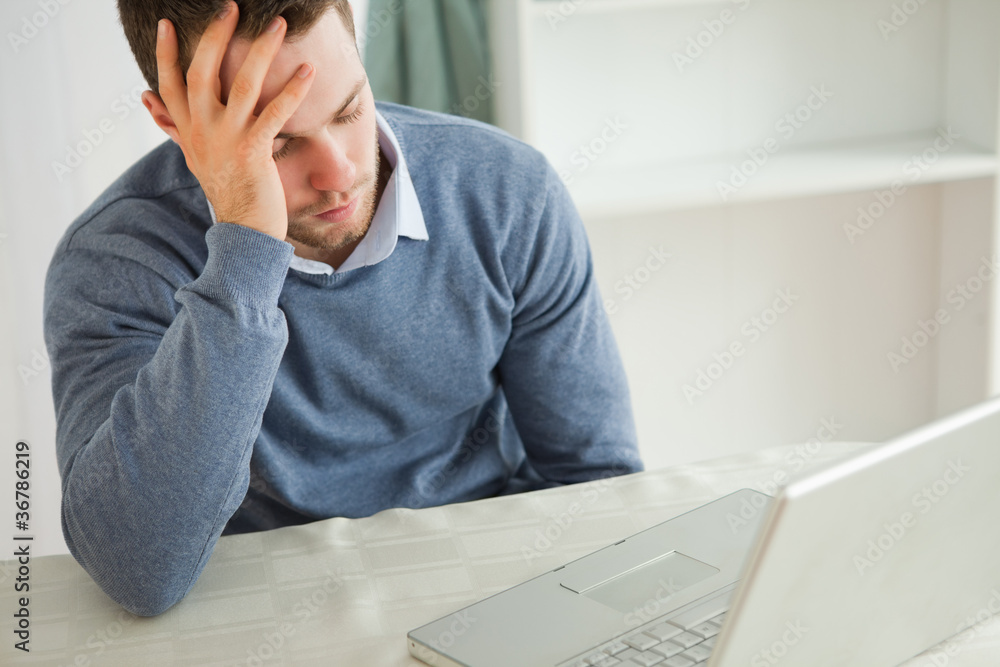 Businessman almost falling asleep in his homeoffice Businessman almost falling asleep in his homeoffice