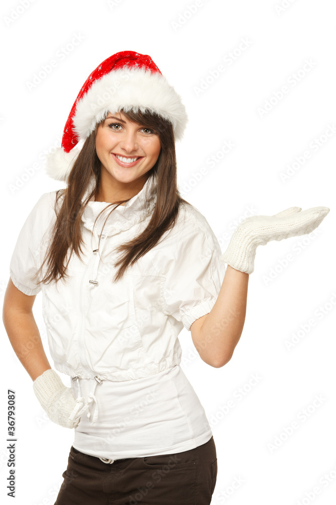 Girl in Santa hat showing product copy space on palm Girl in Santa hat showing product copy space on palm
