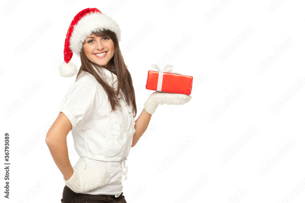Side view of a girl in Santa hat holding a Xmas gift Side view of a girl in Santa hat holding a Xmas gift