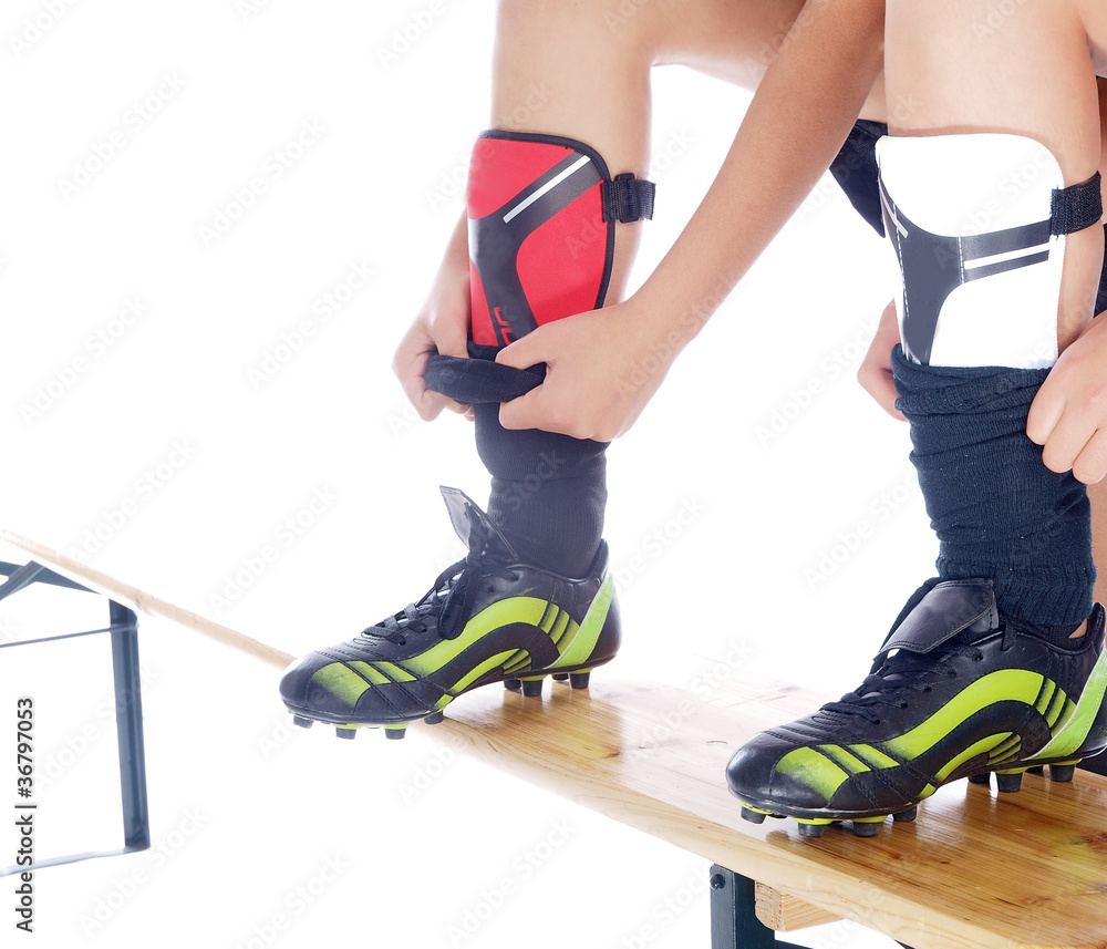 girls putting on their soccer shin guards Stock Photo Adobe Stock