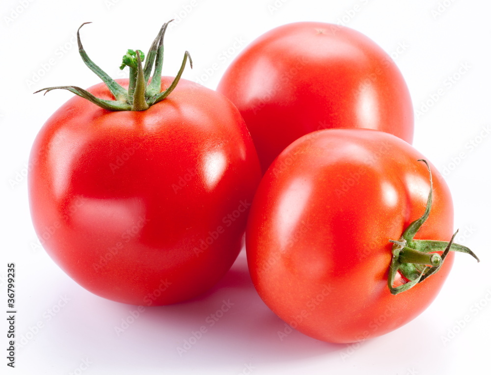 Ripe tomatoes isolated on a white background. Ripe tomatoes isolated on a white background.
