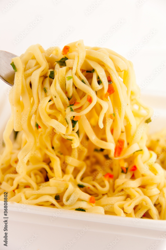Delicious noodle cooking with spices. Macro shot Delicious noodle cooking with spices. Macro shot