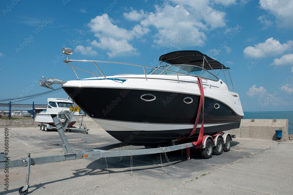 Pleasure boat on the dock, sunny summer day