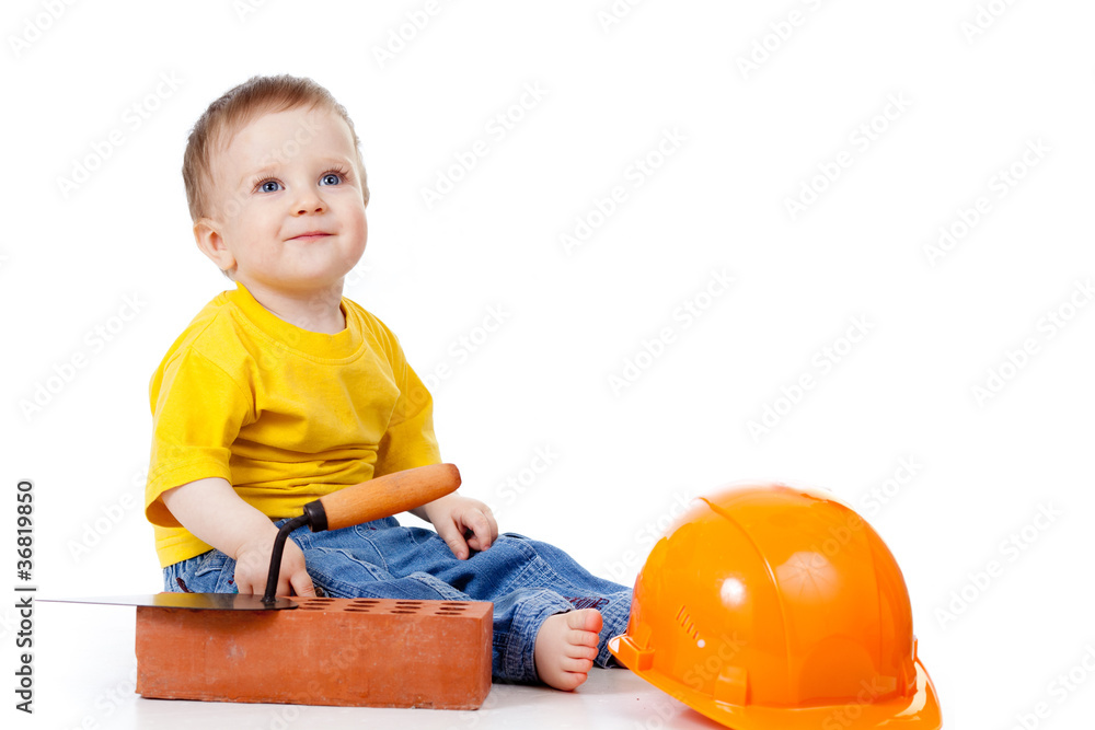 smiling child with hard hat and construction tools smiling child with hard hat and construction tools