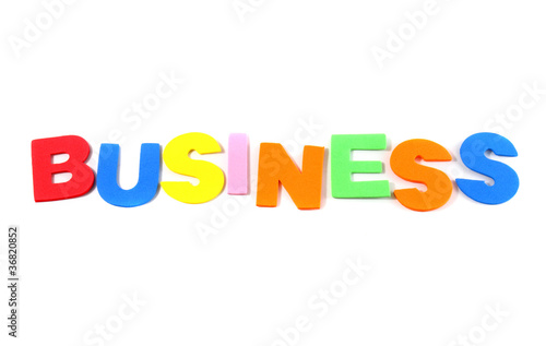 Business in colorful toy letters on white background