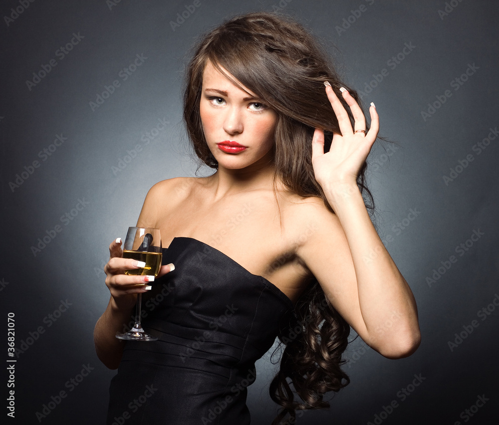 Beautiful sexy woman with a glass of white wine Beautiful sexy woman with a glass of white wine