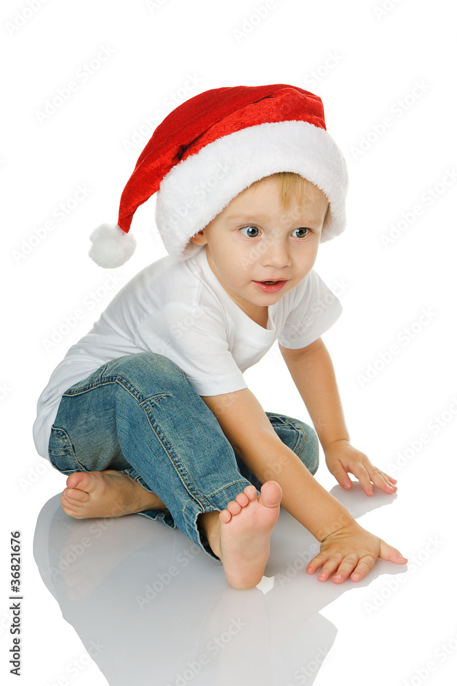 Christmas kid in Santa hat isolated on white background Christmas kid in Santa hat isolated on white background