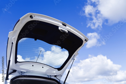 Open luggage carrier of the car against the blue sky