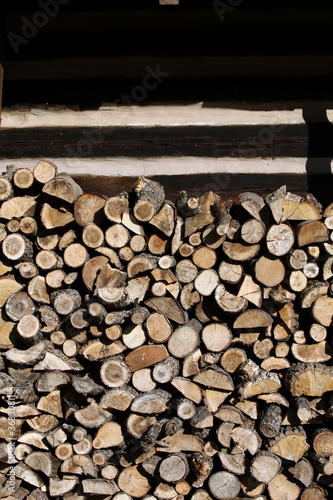 firewood arranged by the country cottage