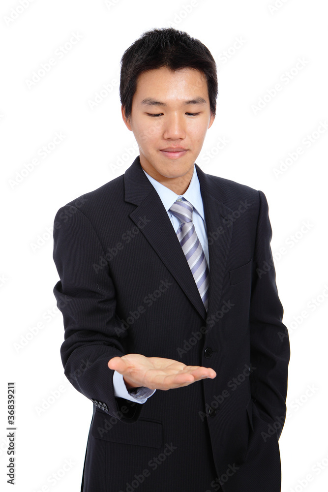 young business man holding hand presenting a product young business man holding hand presenting a product