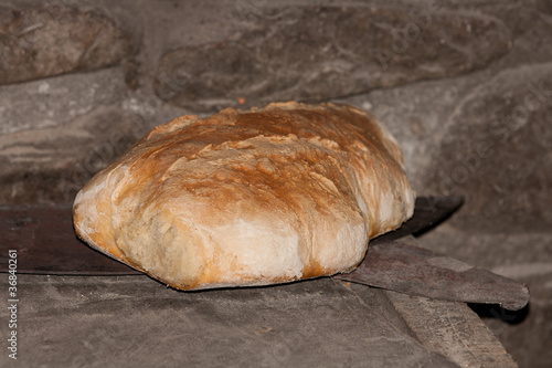 Dos hogazas de pan saliendo del horno de leña photo