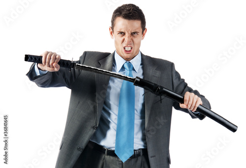 a young aggressive businessman with japanese sword