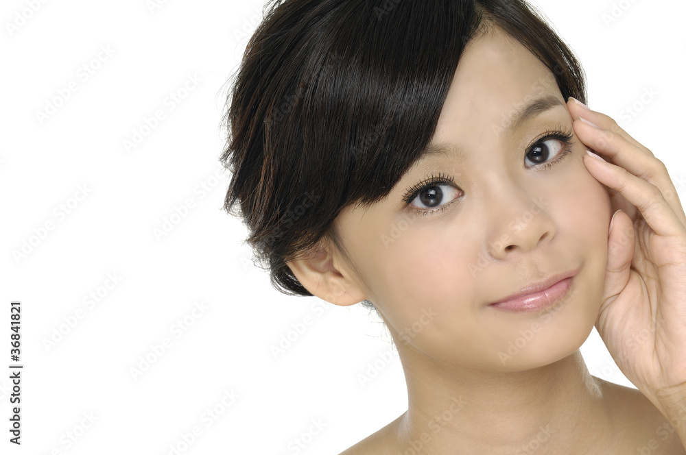 Beautiful young woman stroking her clean beauty face Beautiful young woman stroking her clean beauty face