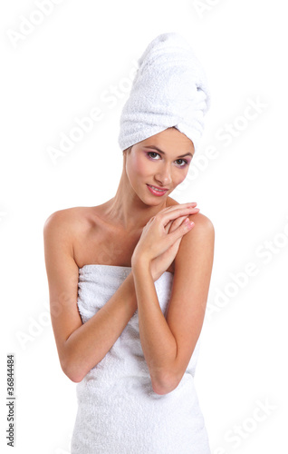 Healthy woman in towel over white