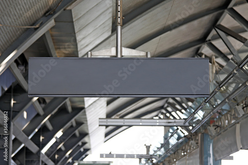 hanging blank metal signpost at the station