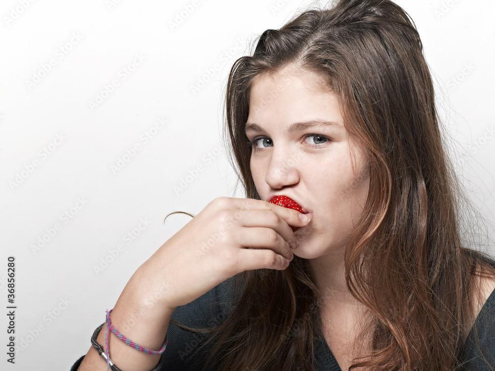 Young beautiful happy smiling woman with strawberry Young beautiful happy smiling woman with strawberry