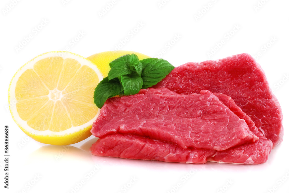 Cut of beef steak with lemon slice. Isolated. Cut of beef steak with lemon slice. Isolated.