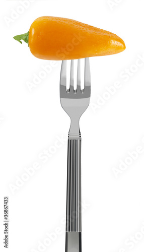 fresh yellow paprika on a fork