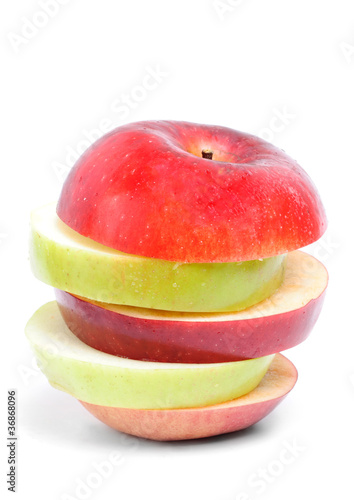 Green and red sliced apple on white background