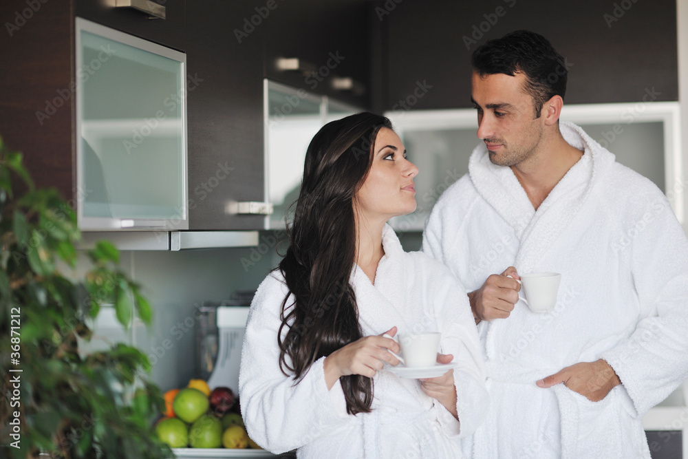 Fototapeta premium Young love couple taking fresh morning cup of coffee