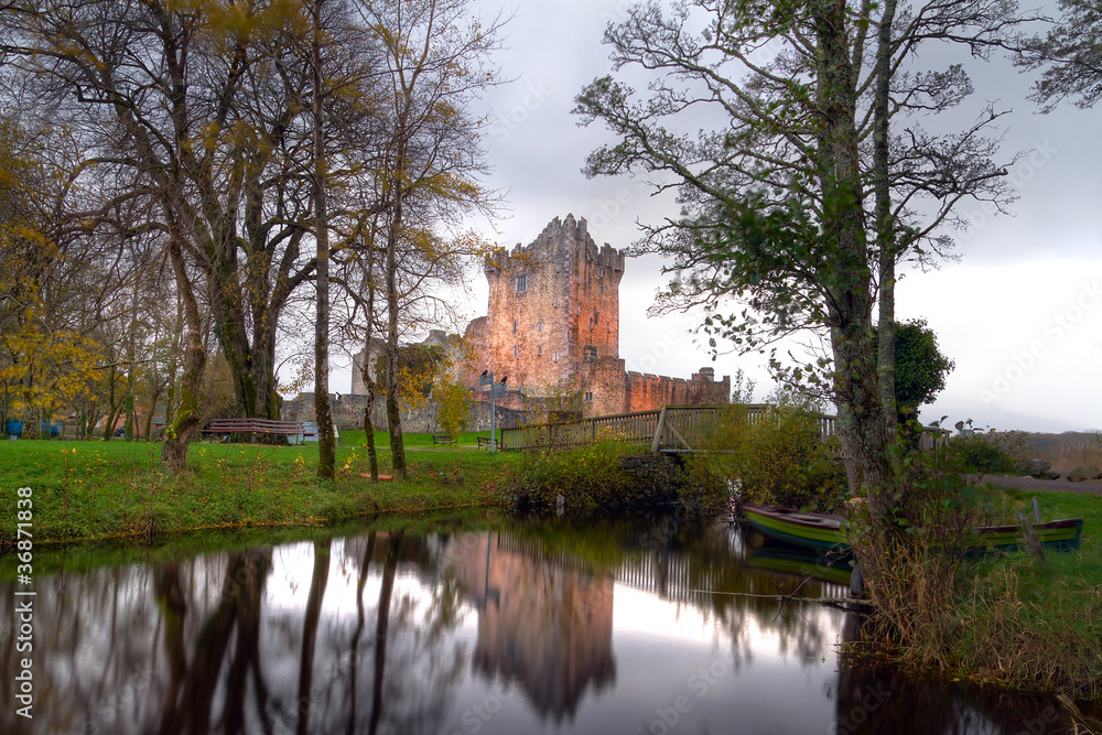 Fototapeta premium Ross Castle reflected at the river at Killarney, Ireland