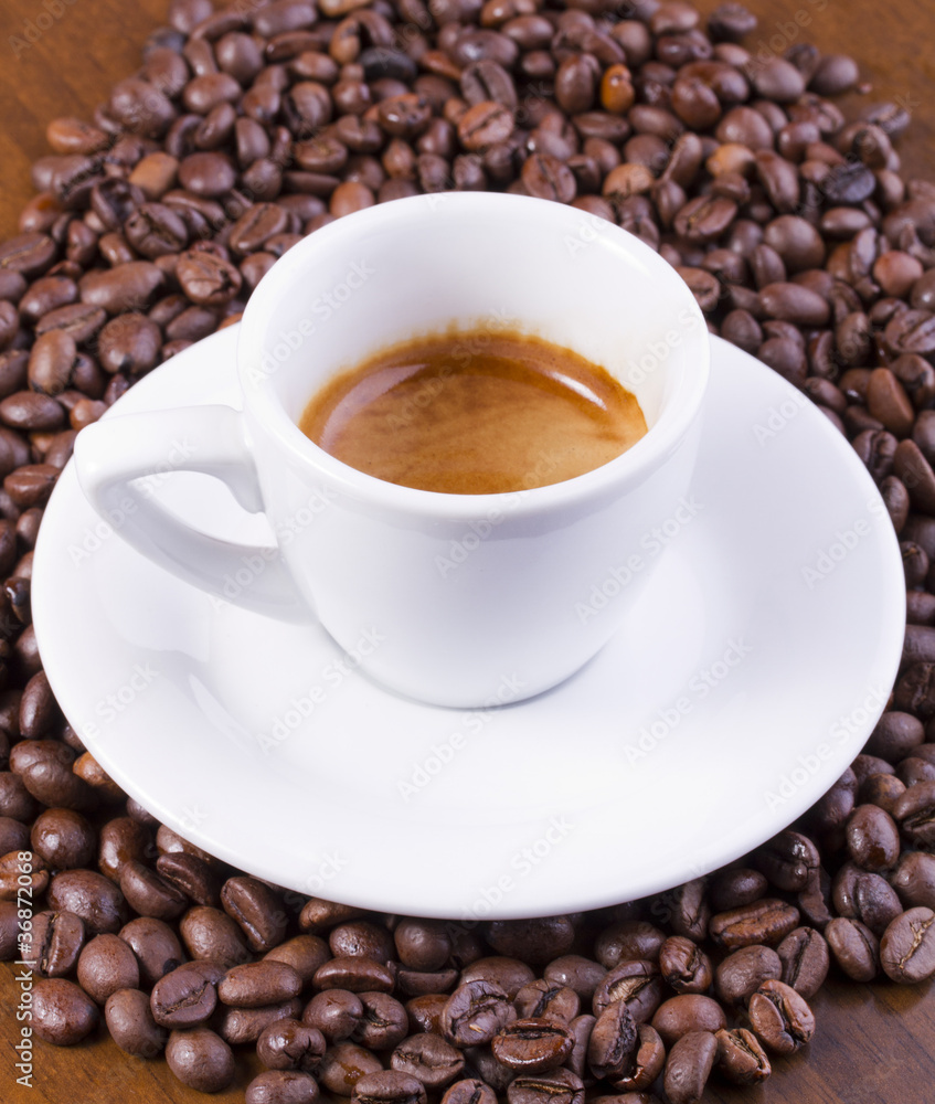 Hot espresso on coffee beans Hot espresso on coffee beans