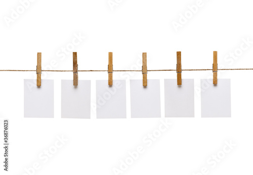 clothes peg and note paper on clothes line rope photo