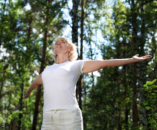 Fotografie Elderly woman playing sports