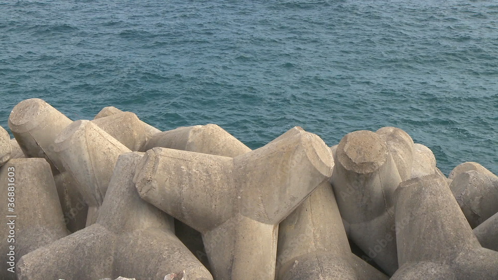 Concrete breakwater in seashore