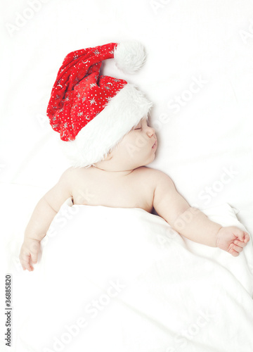 sleeping baby in santa's hat