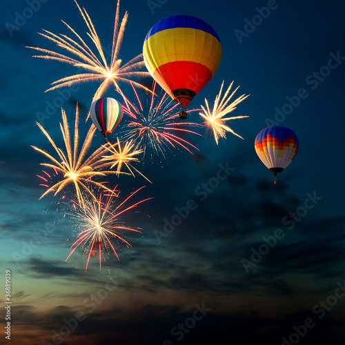 fireworks and hot air-balloon at sunset