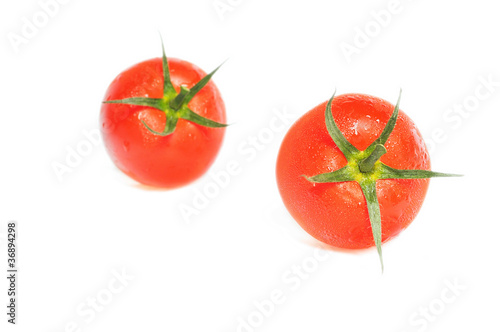 Close-up image of fresh tomatoes isolated on white background