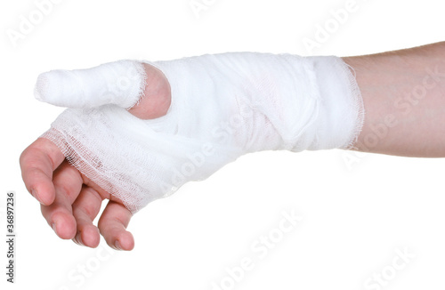 Bandaged hand isolated on white