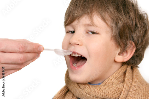 The child drinks a medicine