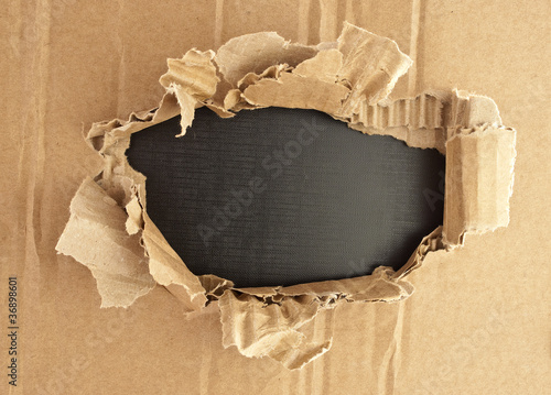 Breakthrough cardboard hole.