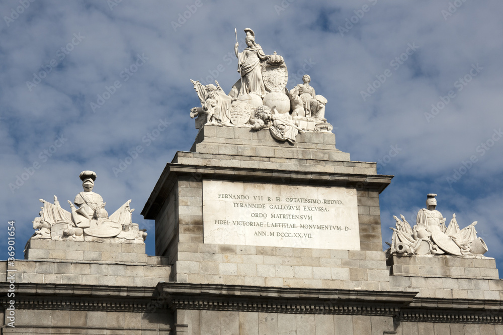 Madrid - Puerta de Toledo detail: a group of sculptures sitting