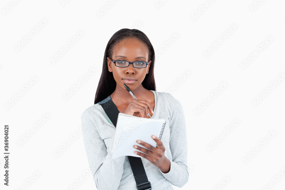 Young woman with glasses and notepad Young woman with glasses and notepad