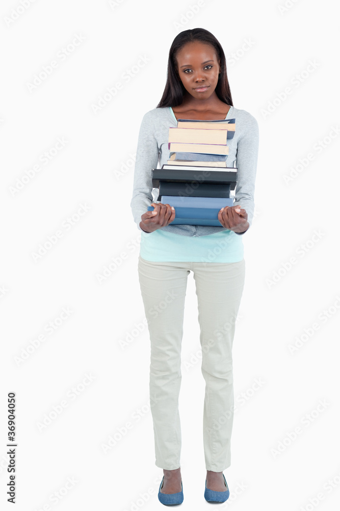 Young woman with a pile of books Young woman with a pile of books