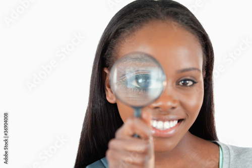 Smiling woman with magnifier