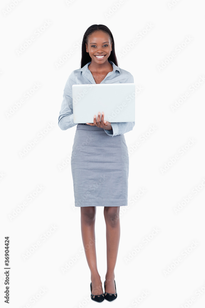 Portrait of a businesswoman using a laptop while standing up Portrait of a businesswoman using a laptop while standing up
