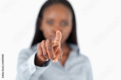 Businesswoman touching an invisible screen