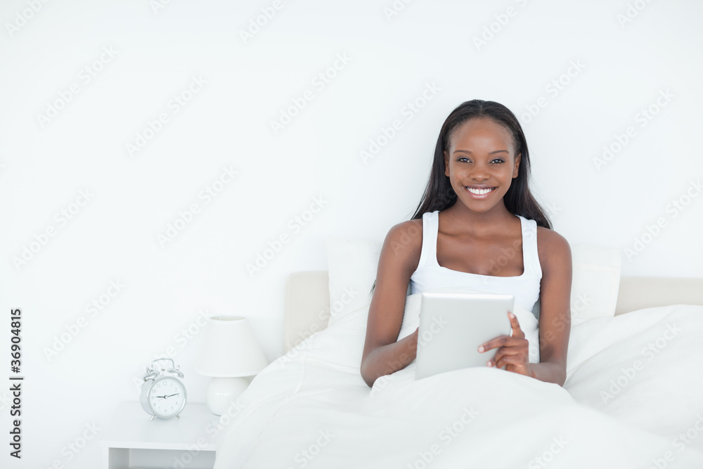 Happy woman using a tablet computer Happy woman using a tablet computer