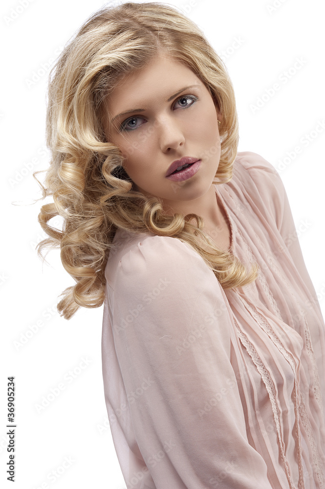 blond young girl with curly hair looking towards camera with att blond young girl with curly hair looking towards camera with att
