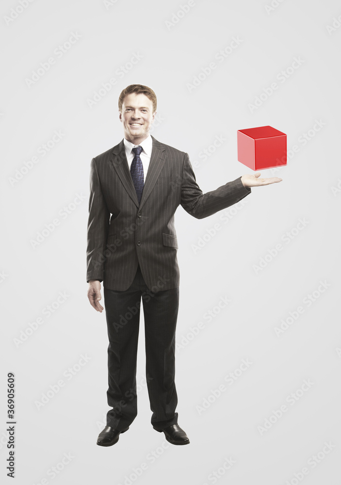Young businessman with red box. Young businessman with red box.