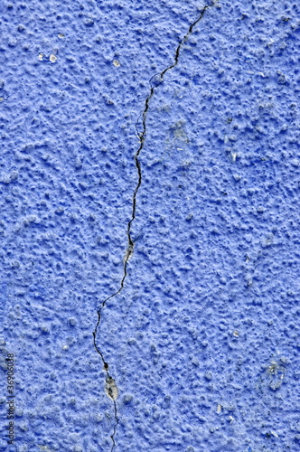 Crack in blue wall